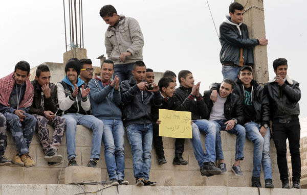Students gather outside the Education Ministry earlier this week to protest against plans to hold the Tawjihi exam once every academic year (Photo by Osama Aqarbeh)